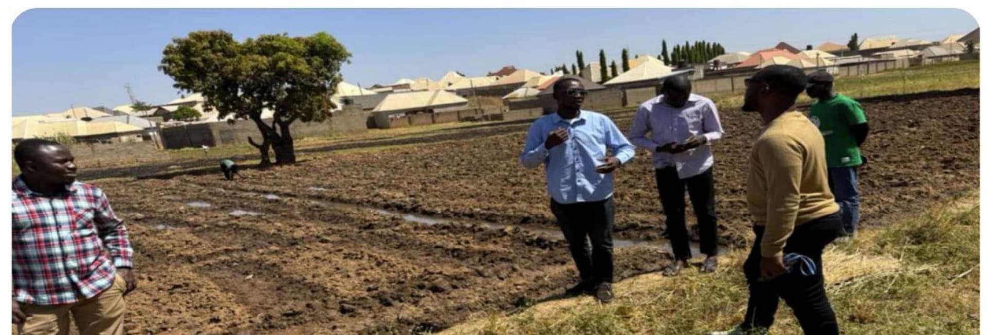 AgAssetCo field team conducting a community productive-use assessment in a farm setting